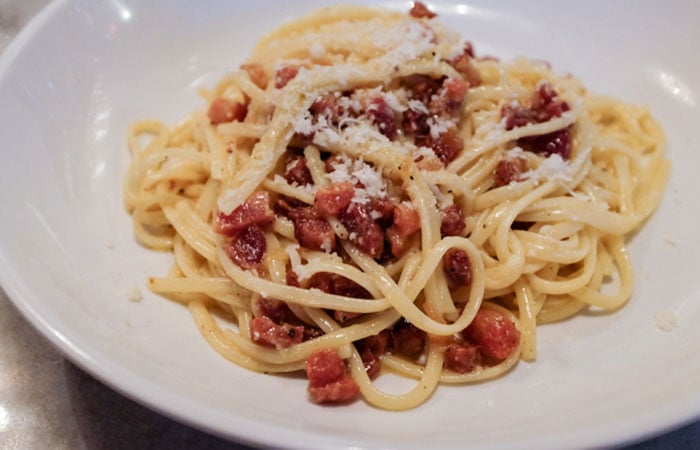 This carbonara includes slab bacon, Portuguese sausage, Parmigiano-Reggiano and Pecorino Romano. Photo by Thomas Obungen.
