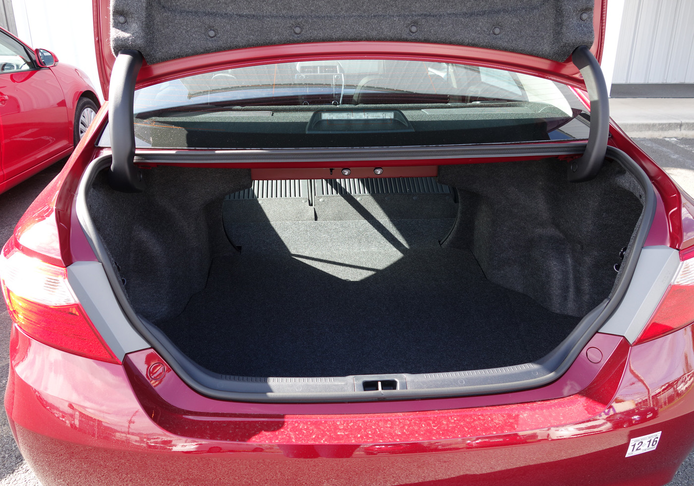 The car trunk, open, with the seat down.