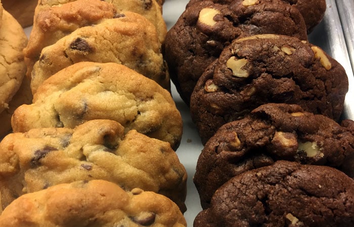 For me, it’s always a toss-up between the double chocolate cookie with chocolate chips and walnuts or the all-American classic stocked with semi-sweet chocolate chips.