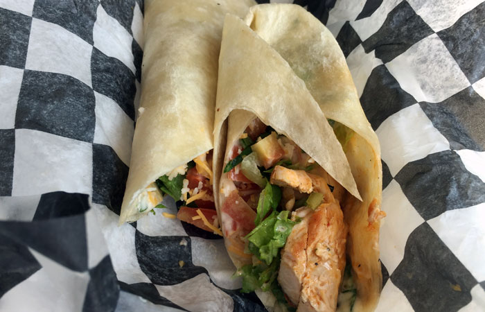 The Buffalo ranch chicken wrap ($7) includes grilled chicken breast, buffalo ranch sauce, lettuce, tomatoes and shredded cheese. Choose among a flour, spinach or tomato-flavored tortilla.