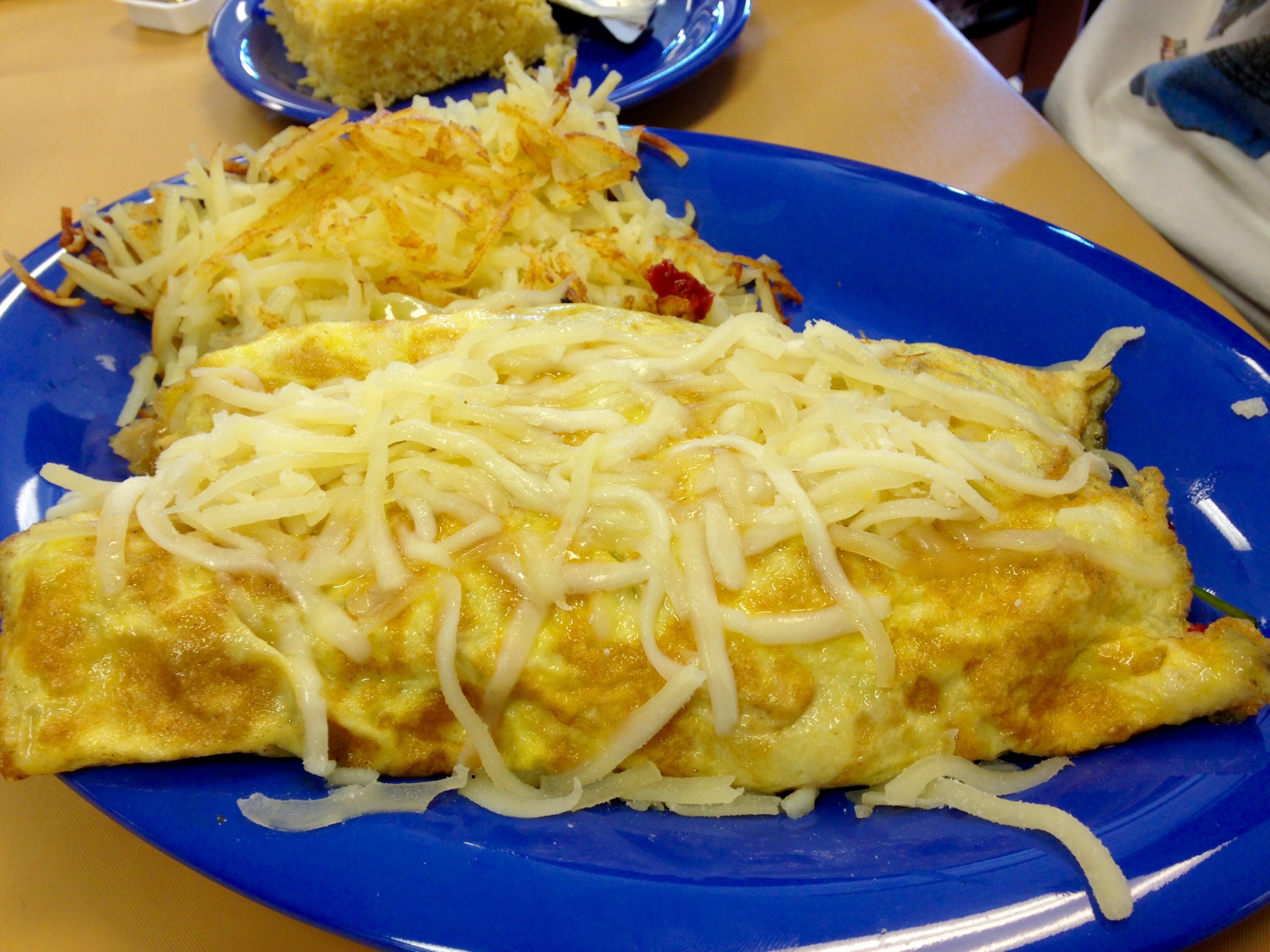 Each omelette comes with your choice of hash browns, rice or fresh fruit and cornbread or toast (get the cornbread). You won't leave hungry that's for sure. They range in price from $7-$11.25. 