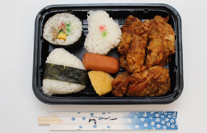 K's Bento-ya is known for opening early (5 a.m.) and closing when they run out (usually before noon). They only make a set number of bentos a day, cash only. 