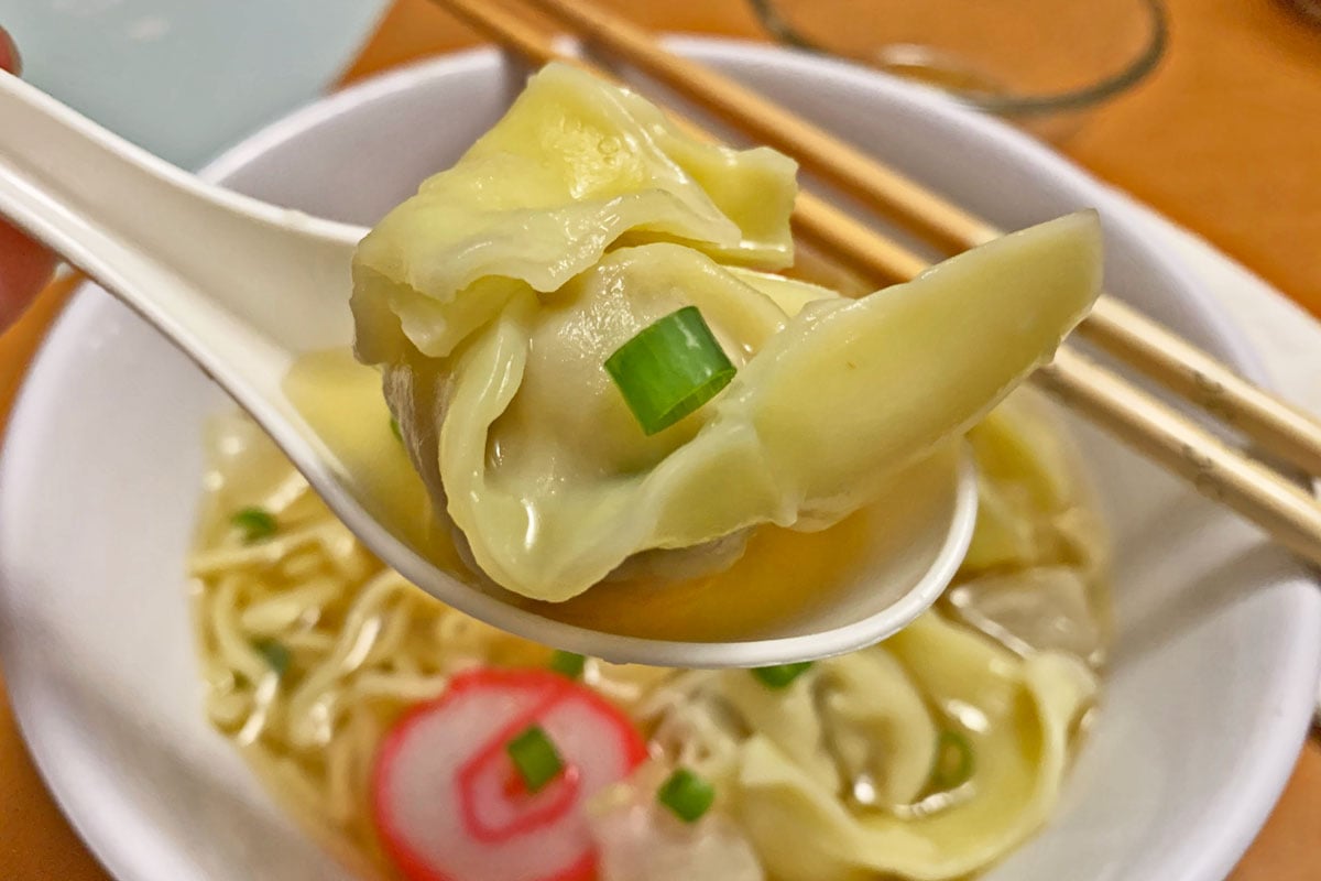 Takeout Container Of Chinese Wonton Soup With Chopsticks On A