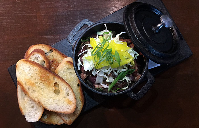 For those looking for some extra spice, try the Creole red beans, which consist of smoked ham hock, pork ribs, pickled peppers and cabbage and are served with crostini.