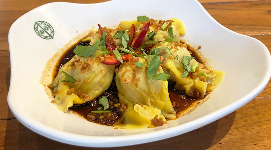 Pork dumplings in spicy sauce