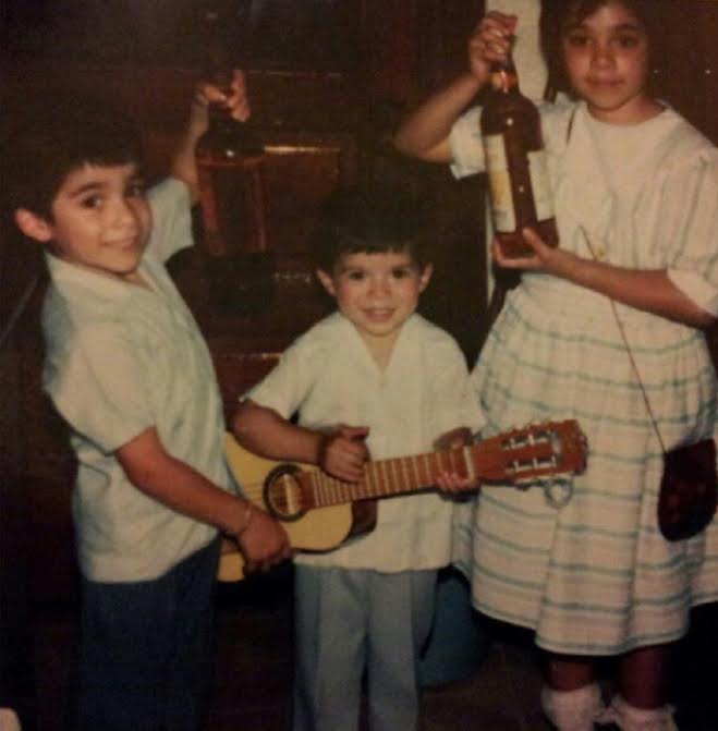 Eddie Lopez (center, age 3)