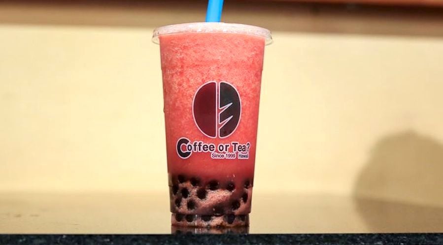 tall cup of watermelon juice with boba pearls