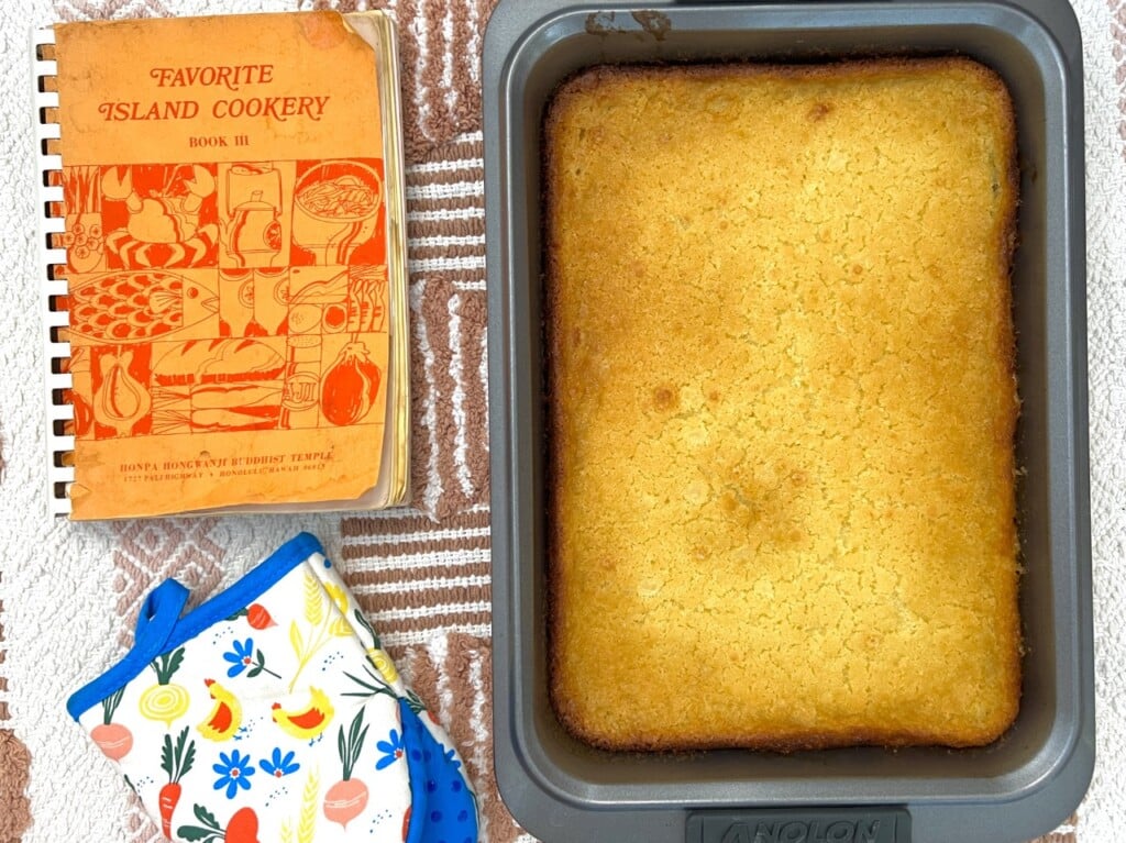 Favorite Island Cookbook and Freshly Baked Mochi Cake shot from above on a kitchen table