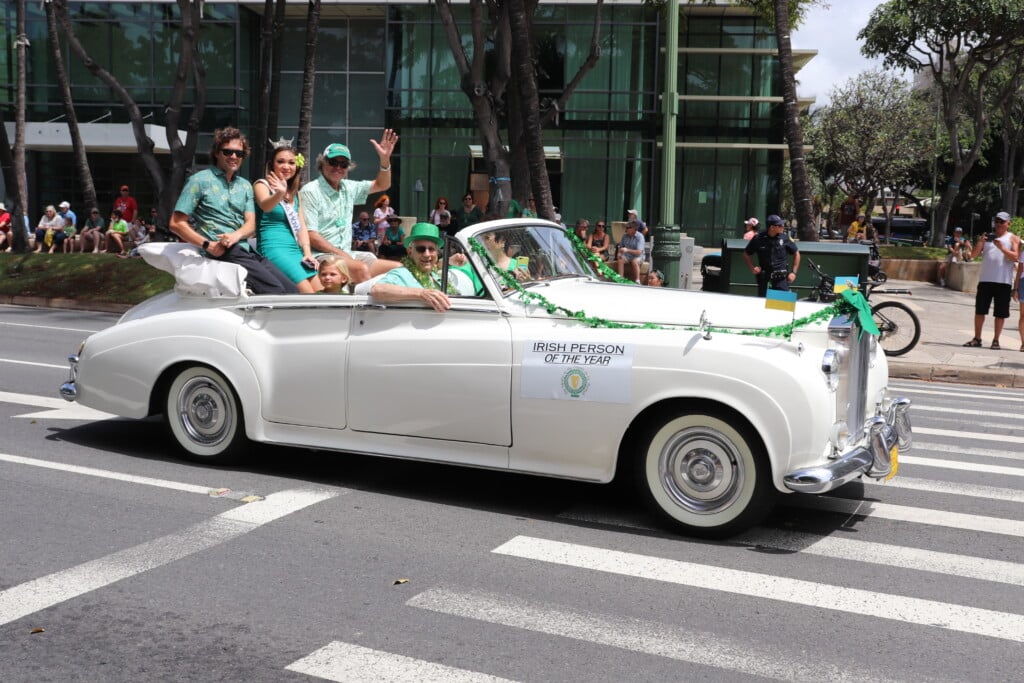 St. Patricks' Day Parade with white, vintage convertible