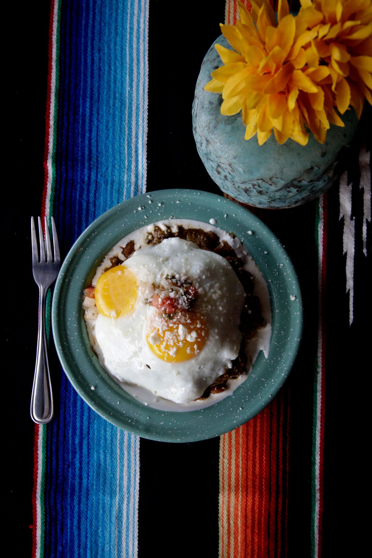 Mexi-Loco Moco with green chili, tender pork over a bed of rice with cream, 2 eggs, sprinkled with quest fresco. Photo: Olivier Koning