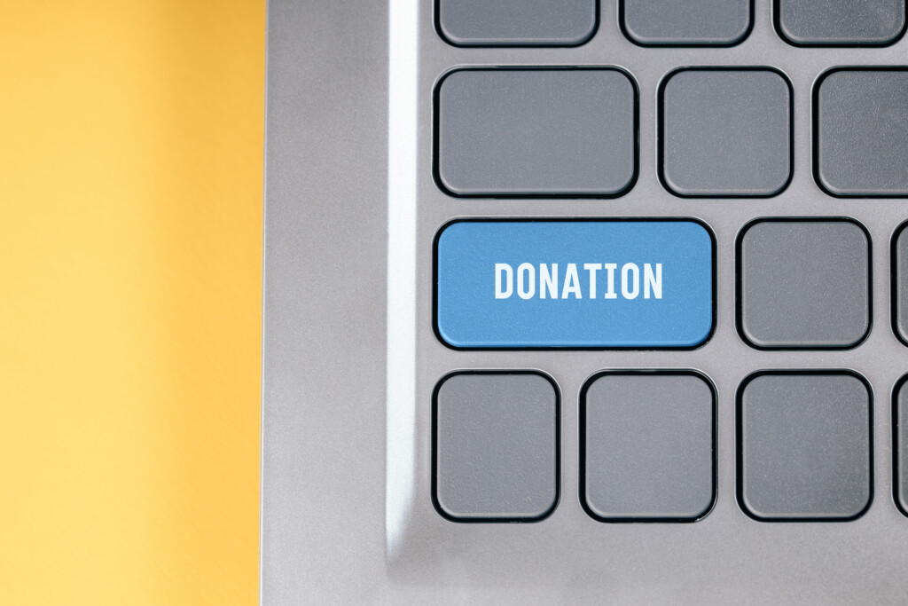 Blue Key With The Text Donation On The Keyboard. Concept Of Charity Online