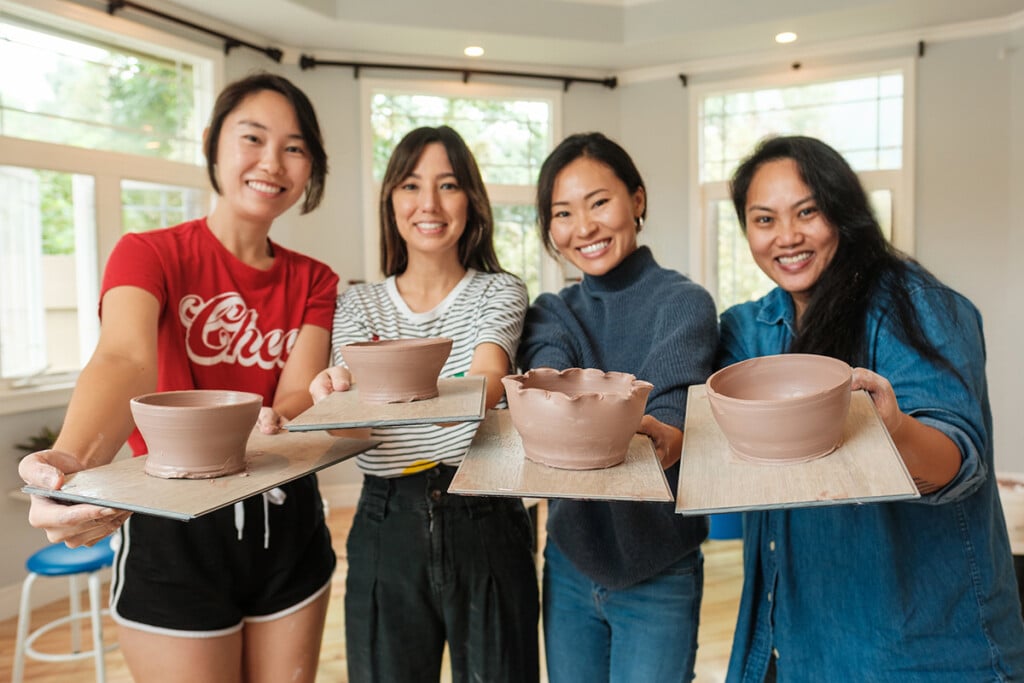 Women holding pottery