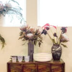 wooden chest with vases and flowers