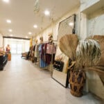 clothing racks and mirror in boutique