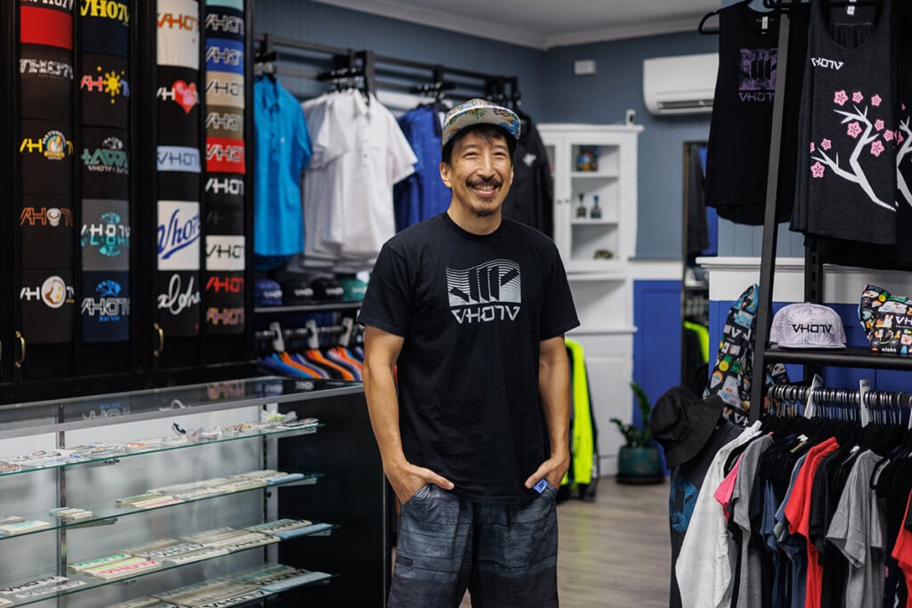 Man standing in front of T-shirt display