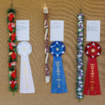 row of hanging lei and prize ribbons