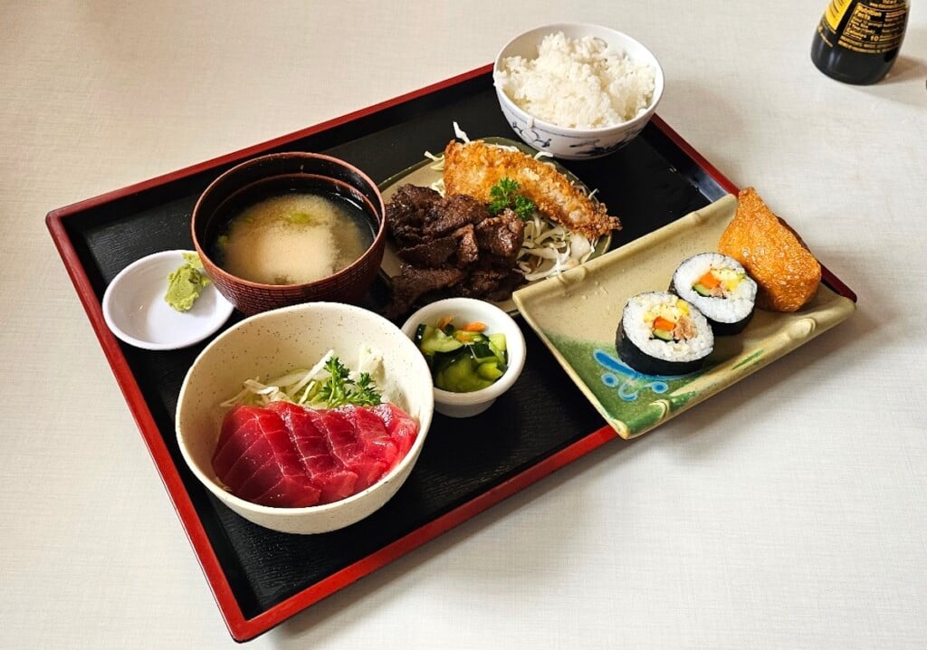 lacquer tray with sashimi, sushi and other dishes at Teshima’s