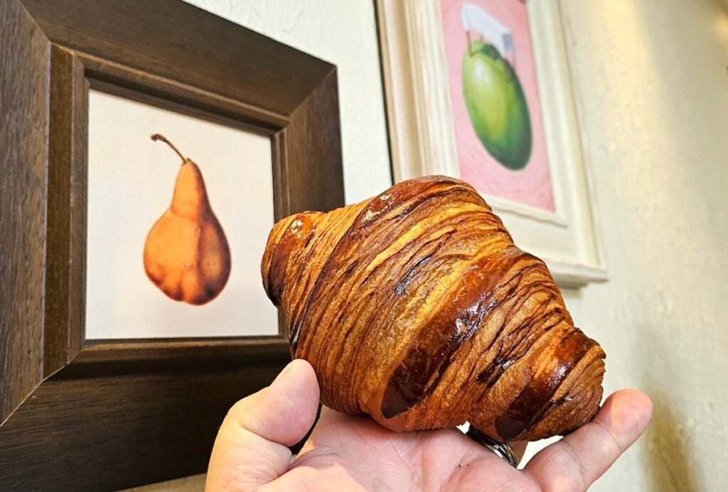 hand holding Croissant