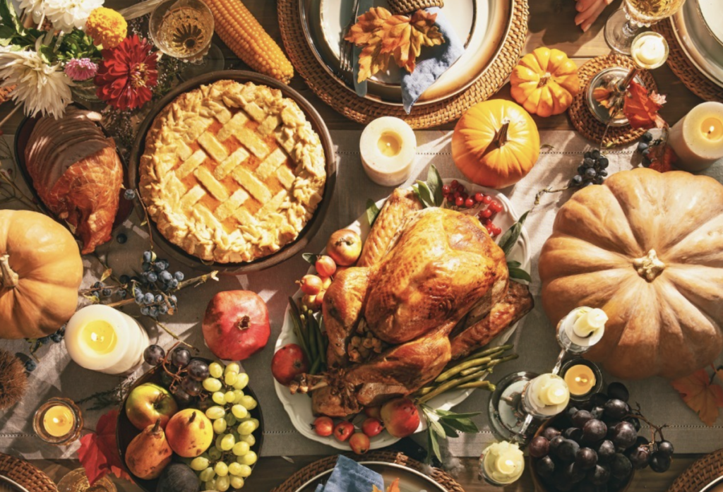 Thanksgiving spread with turkey at center