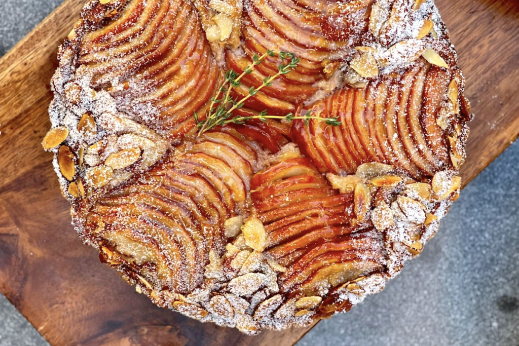 layers of sliced apples crown a thanksgiving pie