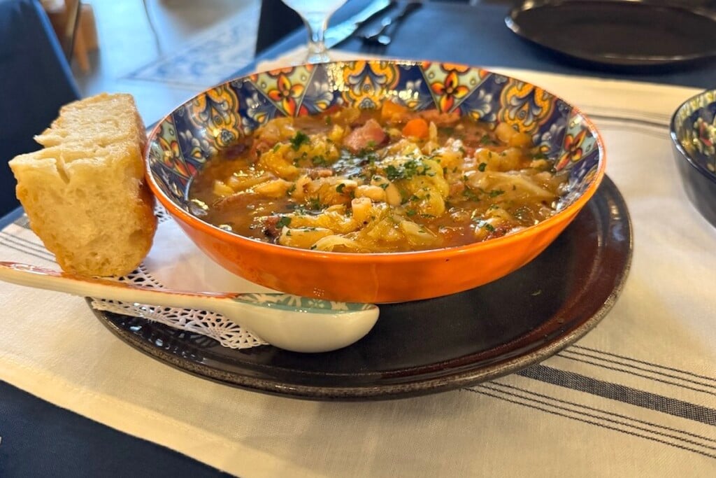 large colorful bowl of Portuguese Bean Soup at faria