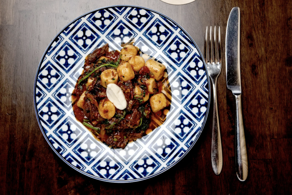 gnocchi pasta on blue and white plate