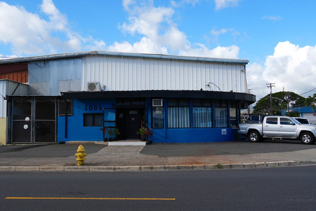 blue industrial building with blue sky