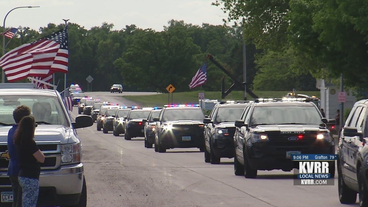 Officer Holte's procession ends in Halstad, hometown community joins to