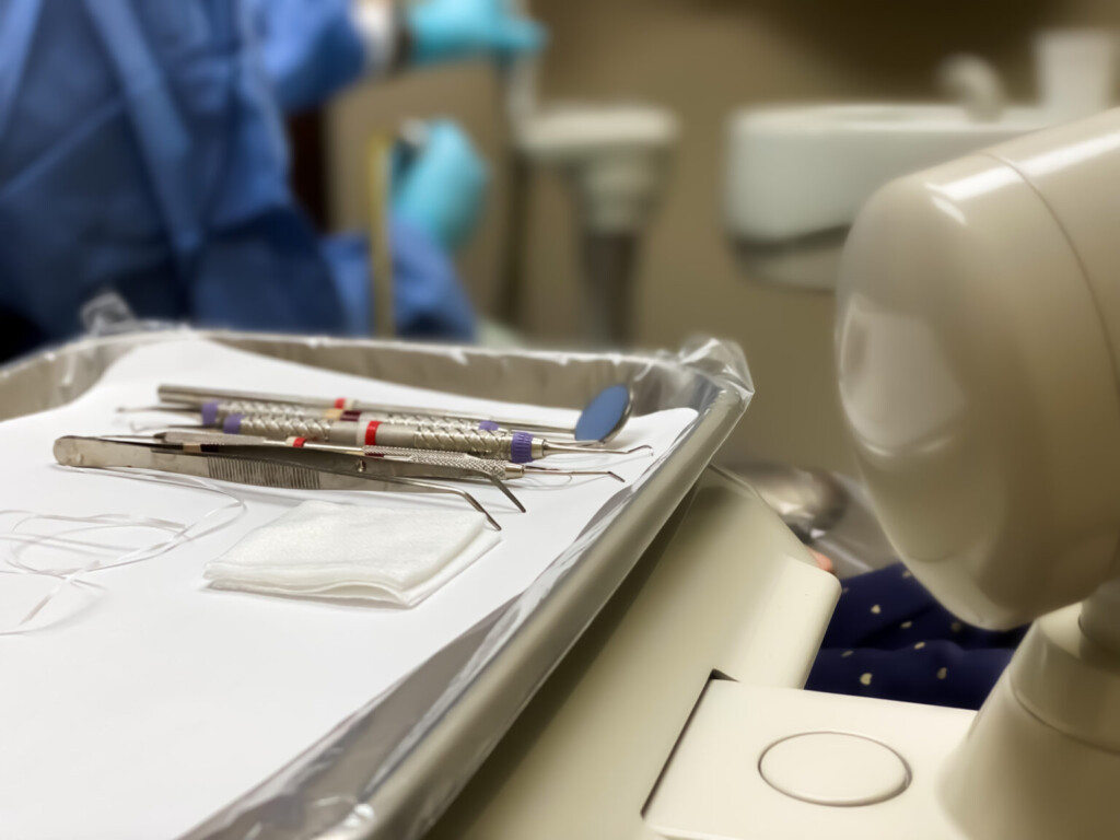 Patient Lying Down On Dentist Chair For Regular Teeth Cleaning