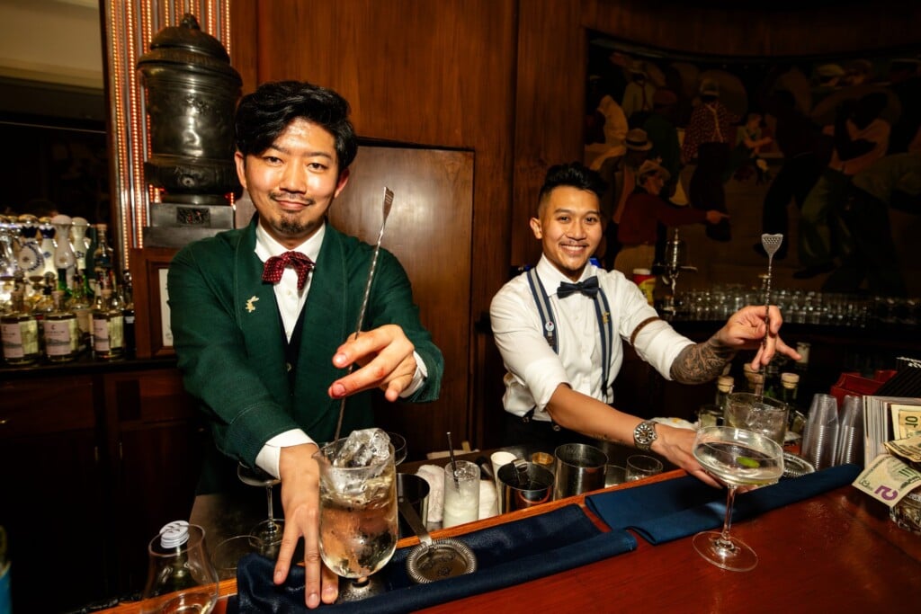 Tales of the Cocktail website image: two bartenders make drinks