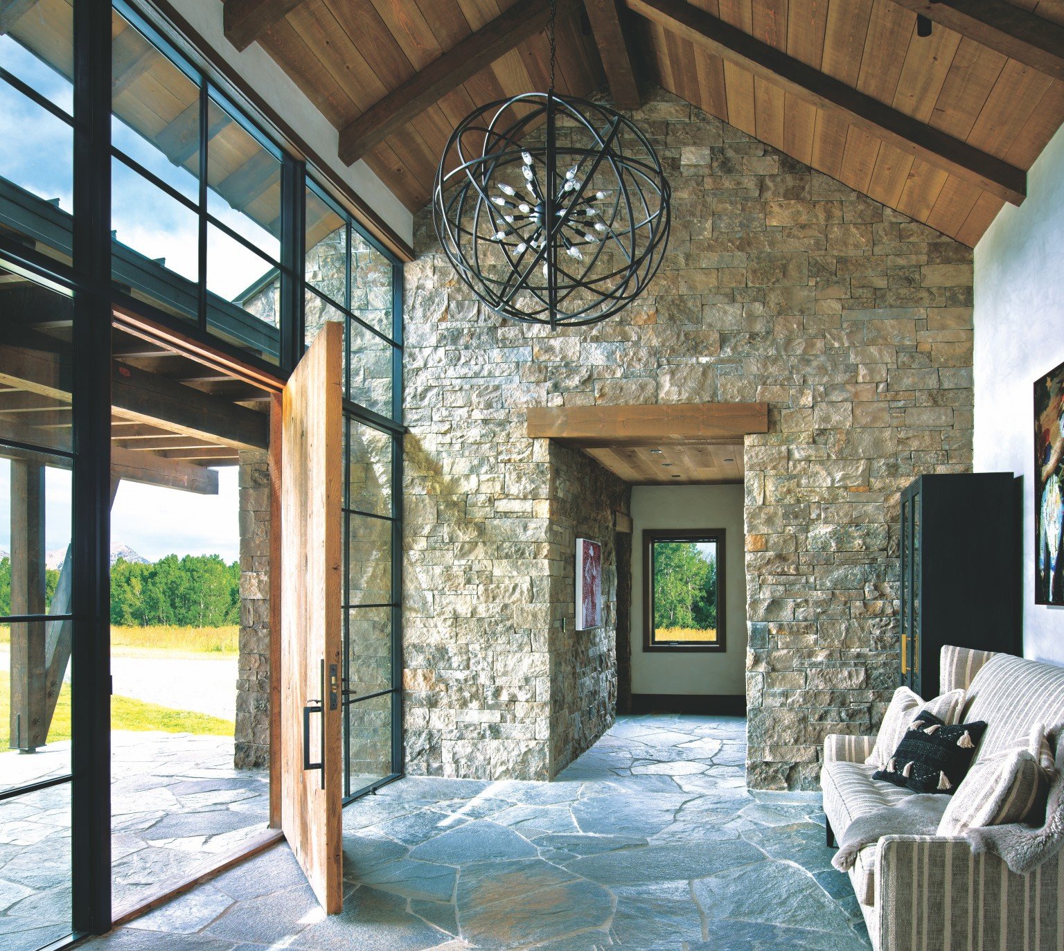 Three Generations Come Together In A Rustic Montana Home Mountain Living   Limestone Entry 1536x1373 