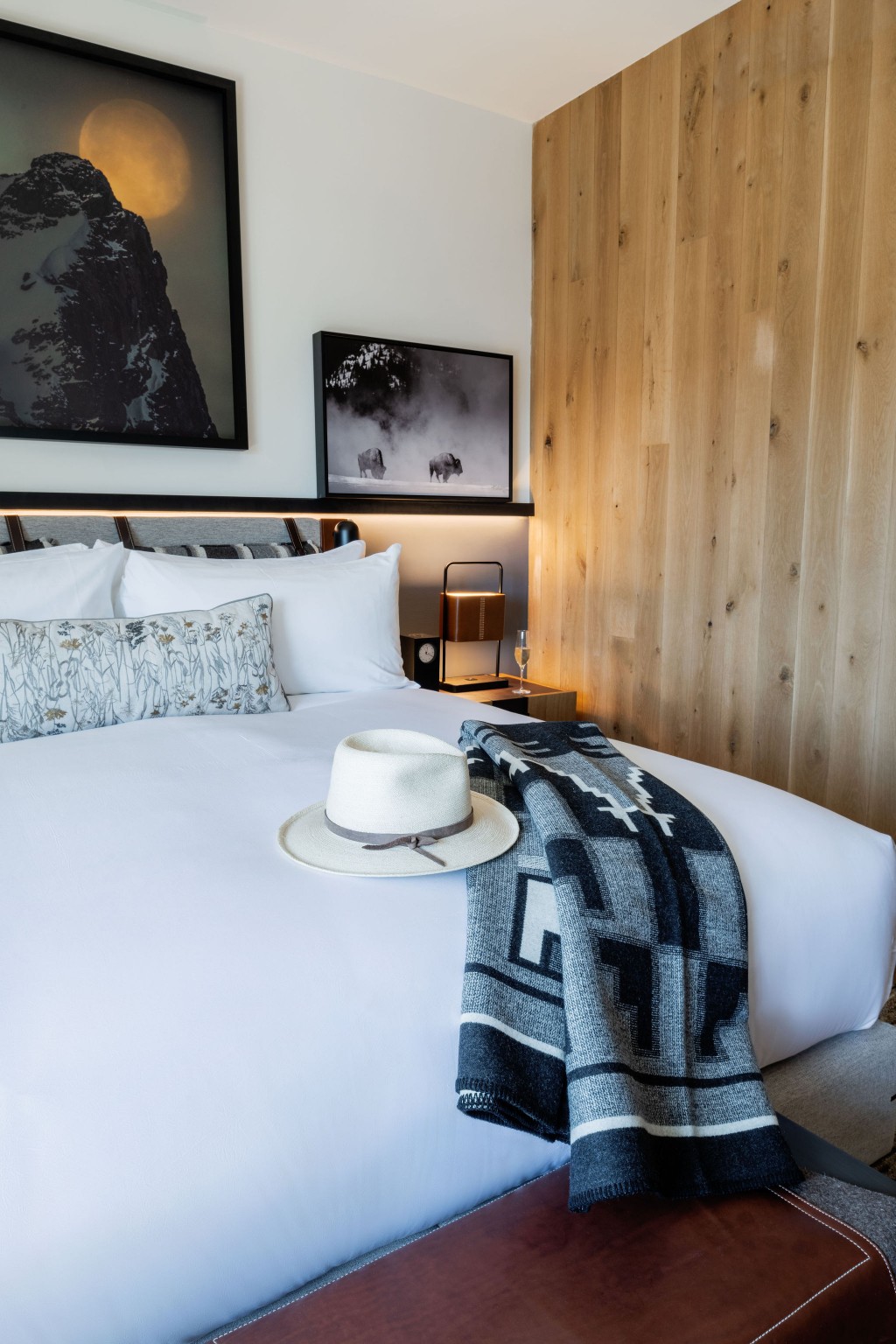 The Cloudveil is committed to supporting local artists and has curated an extensive art collection, installed throughout the property. Black-and-white photographs add contrast and a point of focus in a guest room.
