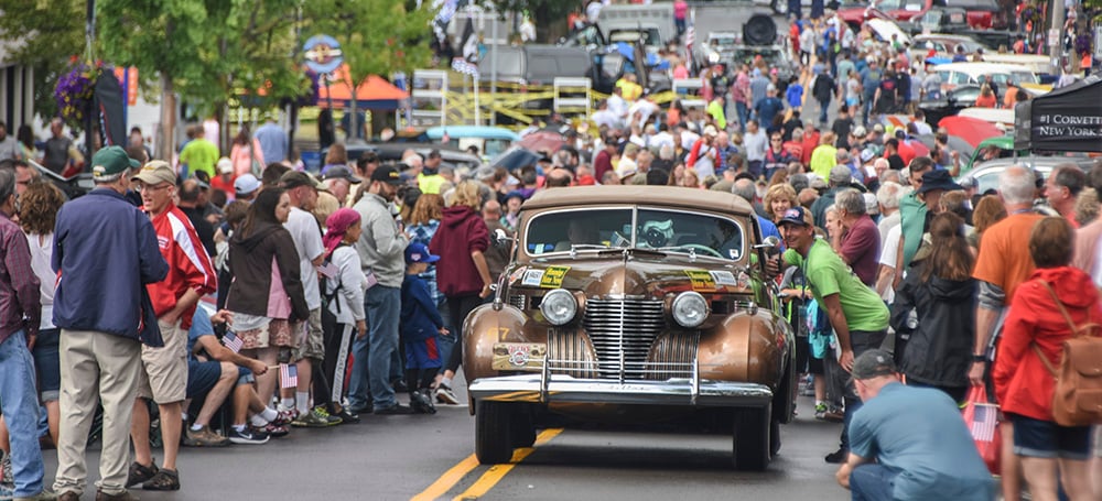 A 1941 Cadillac Pulls Through The Crowd In Fairport Ny