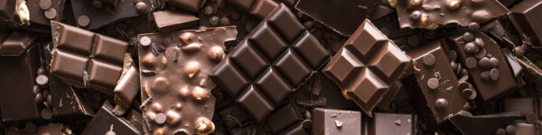 Chocolate Assortment Background. Top View Of Different Kinds Of Chocolate