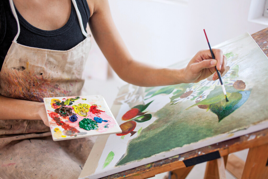 Female Artist Working In Studio