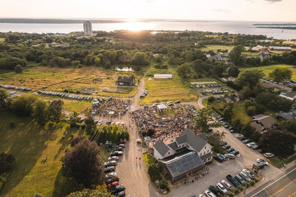 An aerial view of a farm property at sunset.