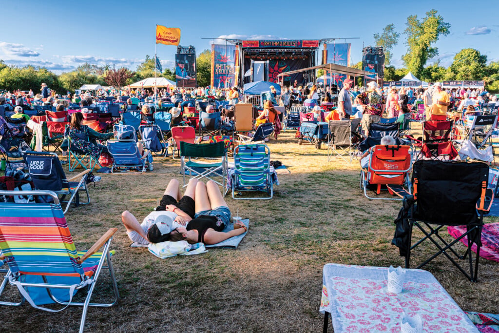 Couple Listening To Duane Betts Performing At The Main Stage.