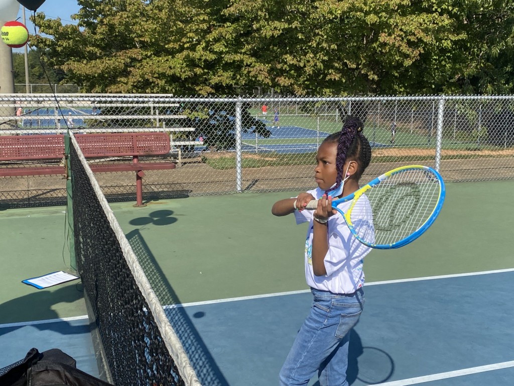 Kid playing tennis