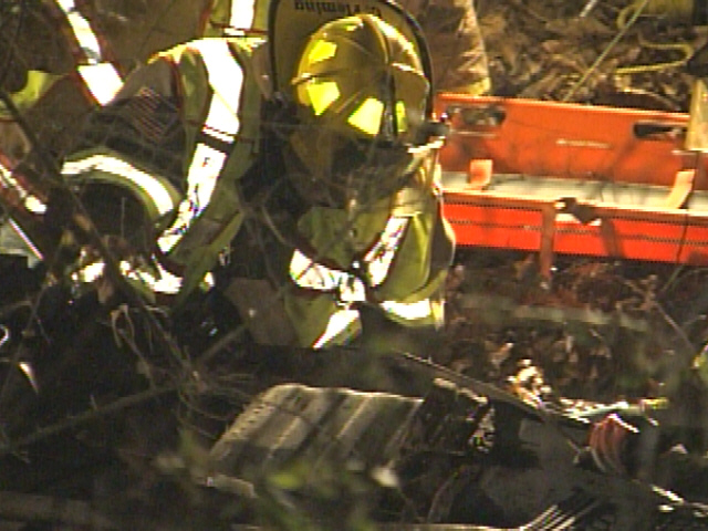 Vehicle In Creek, One Person Trapped