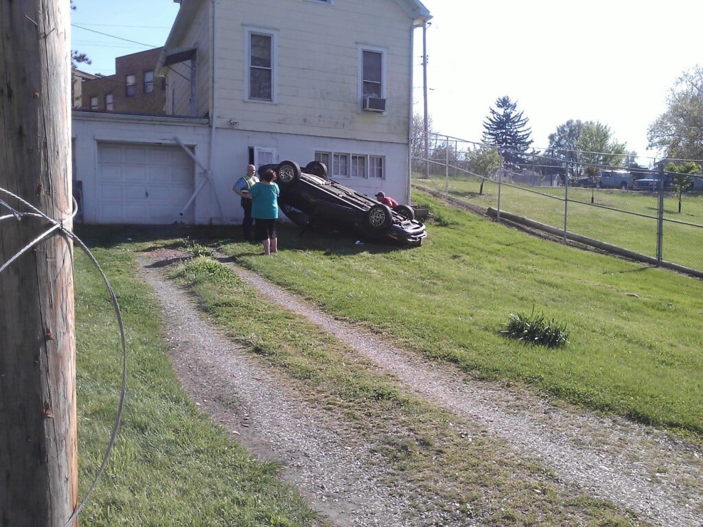 Car Lands On Top Behind Zanesville Home