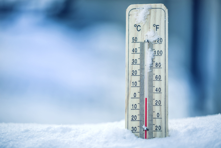 Thermometer On Snow Shows Low Temperatures Zero. Low Temperatures In Degrees Celsius And Fahrenheit. Cold Winter Weather Zero Celsius Thirty Two Farenheit