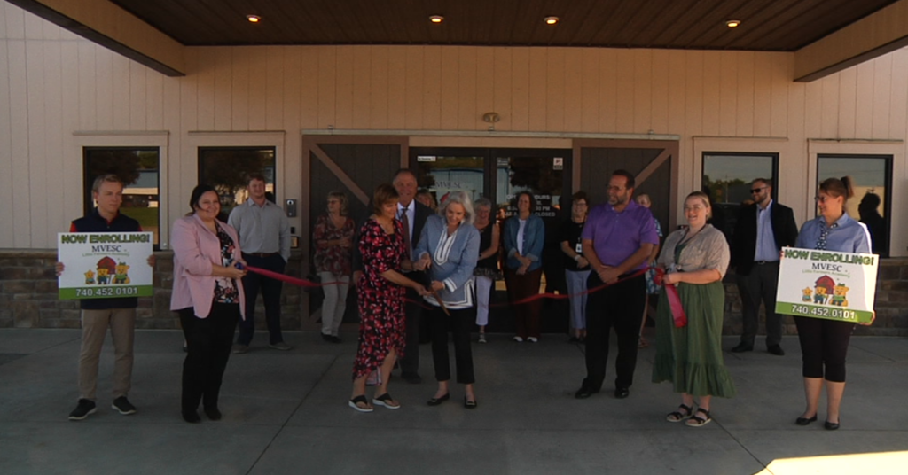 The ribbon cutting ceremony of the Little Farmers Academy by the Muskingum Valley Educational Service Center features Crystal McFarland and Susan Holdren cutting the ribbon. McFarland is the MVESC's director of early childhood services and Holdren is with the J.W. and M.H. Straker Charitable Foundation who awarded grant money to the educational service center.