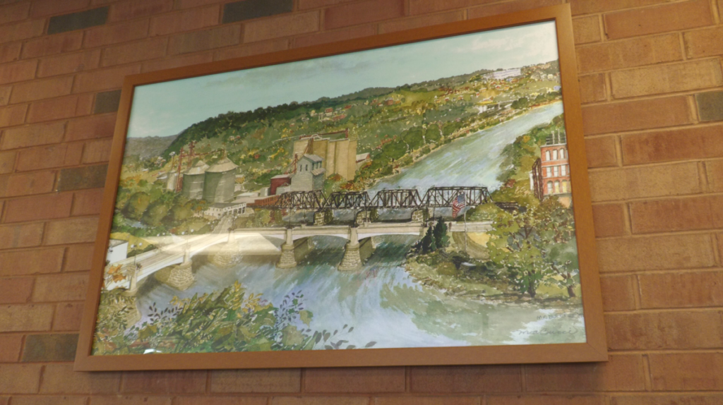 This painting of the Y-Bridge by local artist Mary Ann Bucci hangs in the entry way of Zanesville's Kroger.