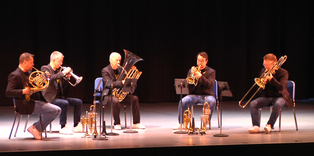 The Canadian Brass performing on the state of the Secrest Auditorium.