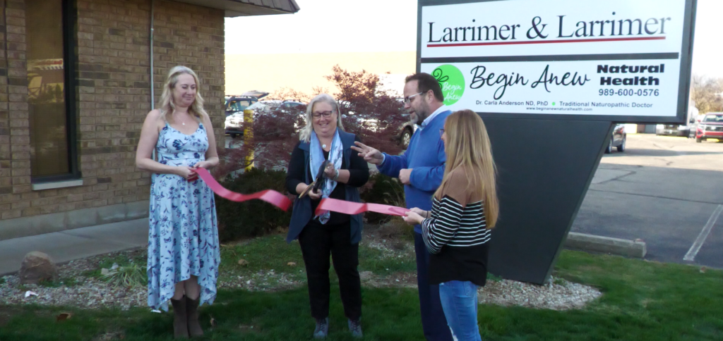 The Begin Anew Natural Health ribbon cutting performed by the owner, Dr. Carla Anderson.