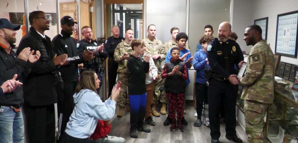 Staff Sgt. Milford Henry is receiving a certificate of commendation from the Zanesville Police Department. During his three years in the city, Henry has worked with Forever Dads, Project Blue Print and coached several youth athletic teams.