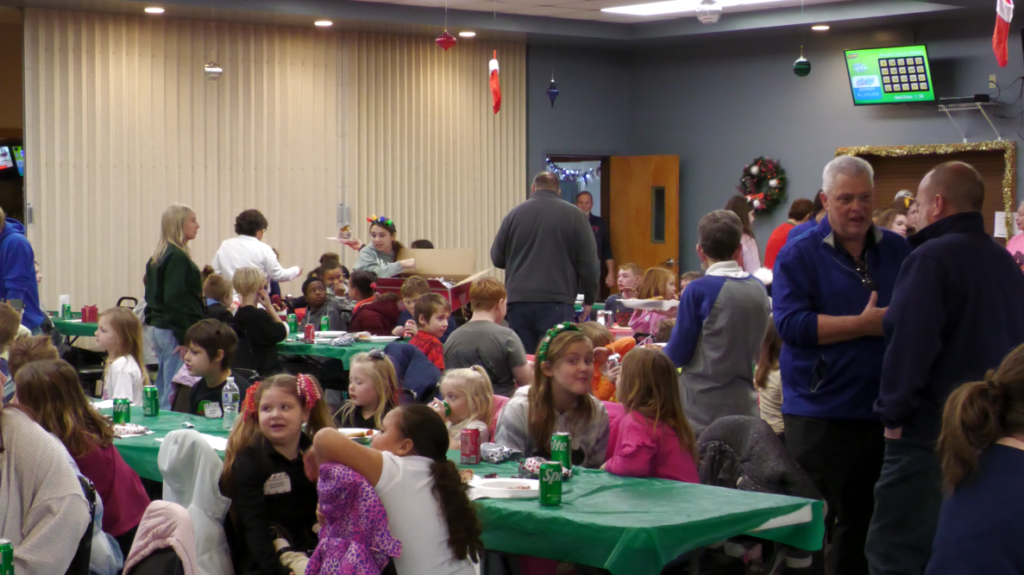 The Kiwanis Club of Zanesville's annual Christmas party saw a record 94 children in attendance.