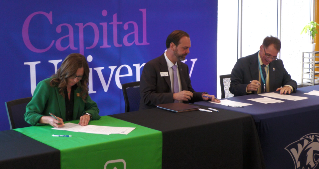 Washington State College President Sarah Parker, Capital University President Jared R. Tice, and Zane State College Interim President Joe Keating signing an articulation agreement.