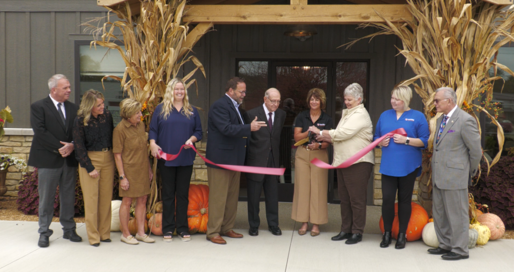 The ribbon cutting ceremony marking 100 years for Young Insurance.